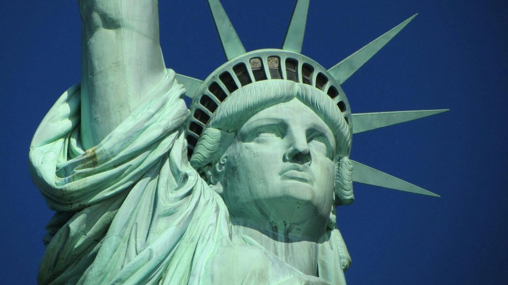 Close up of the Statue of Liberty against a clear blue sky