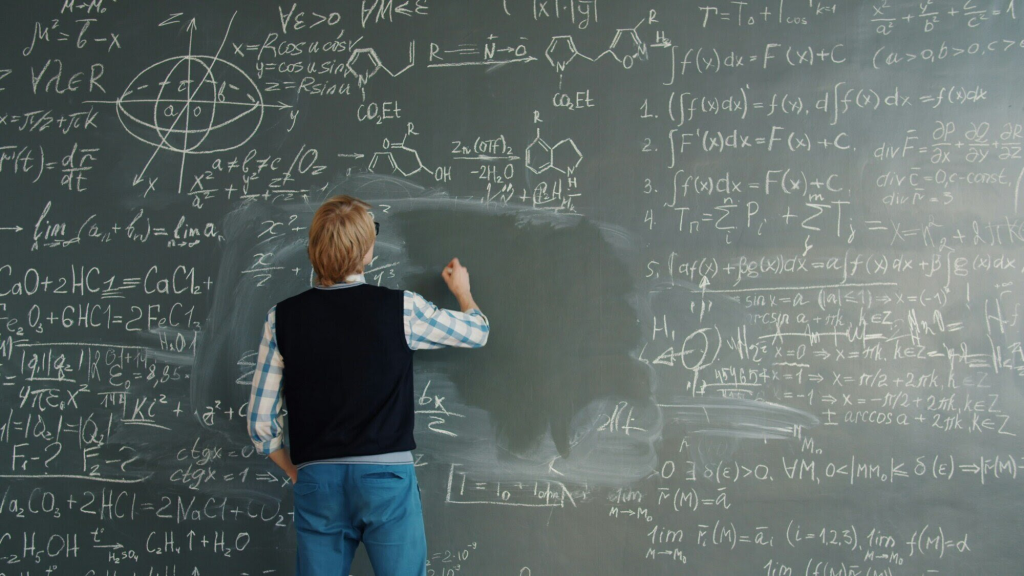 Painting of a person with blue pants and a blue and white shirt and black sweater vest writing on a chalk board full of equations and chemical diagrams